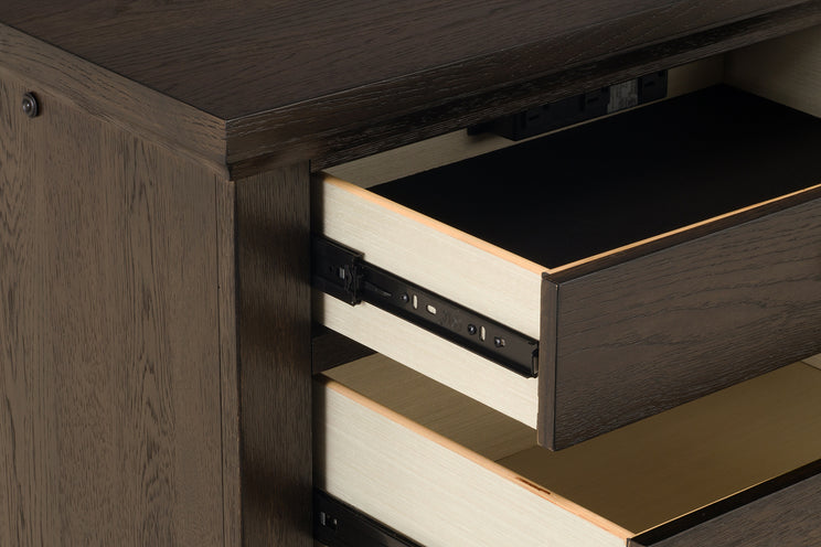 Wooden desk with open drawer showing electrical outlets